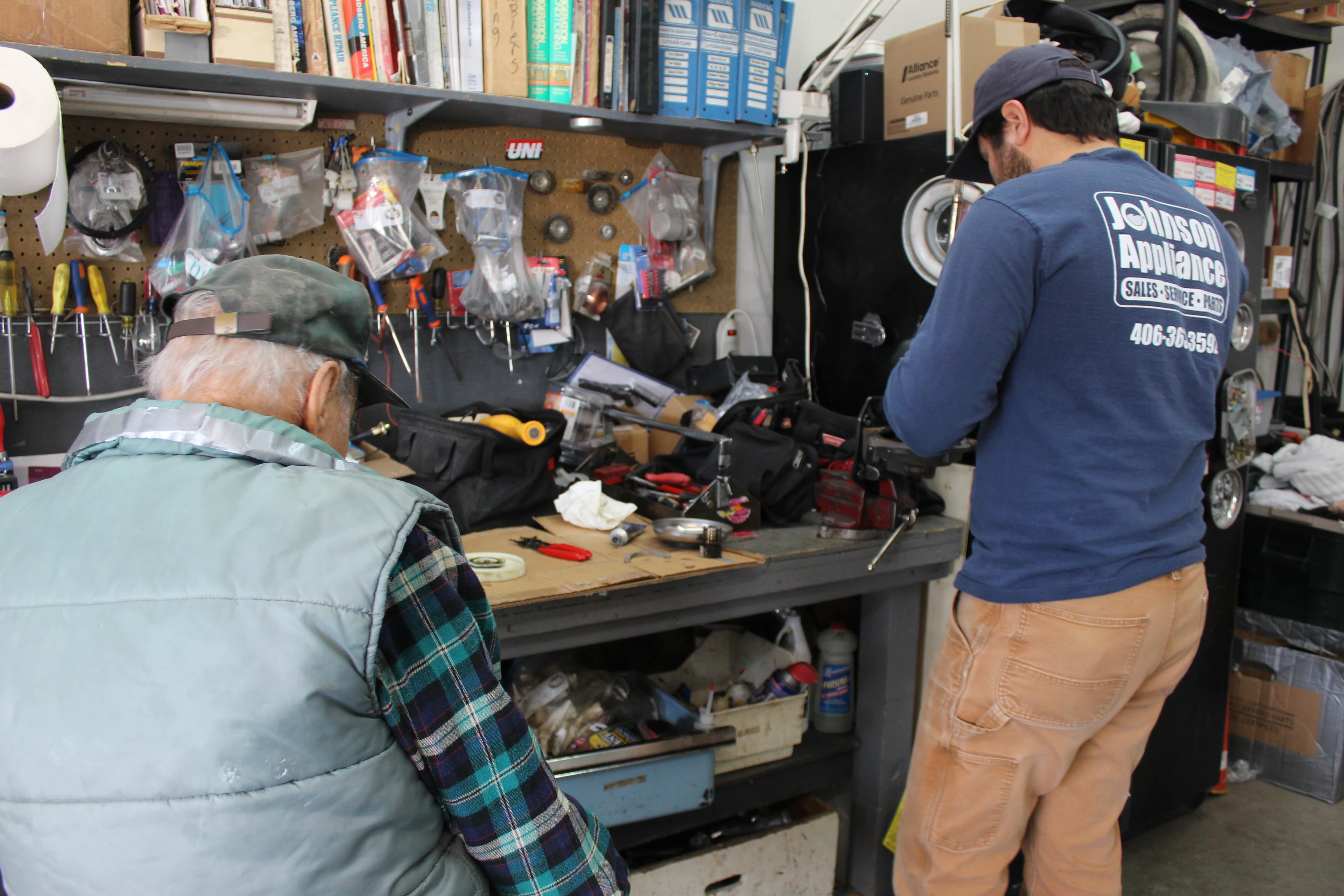 Grandpa & Zachary rebuilding a washer transmission